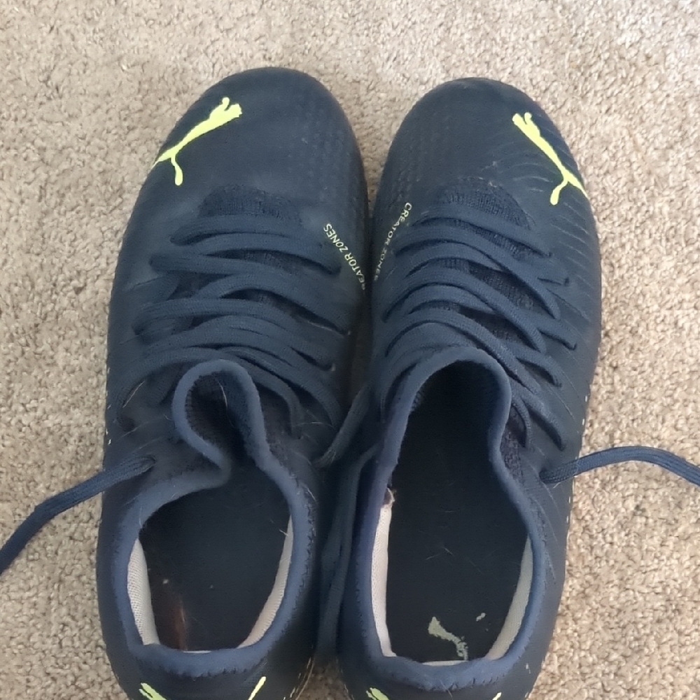 Puma Black and Yellow Athletic Cleats